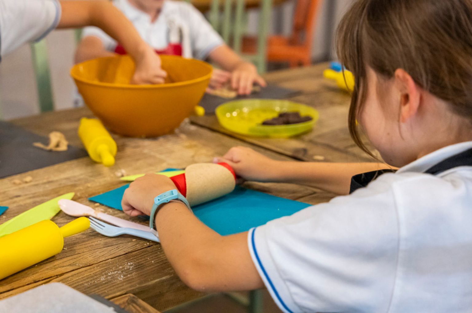 A child cooking in the school kitchen at Colegio Internacional Torrequebrada